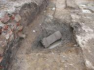 Click to enlarge Image of Roman Road excavation showing altar in pit by PCA